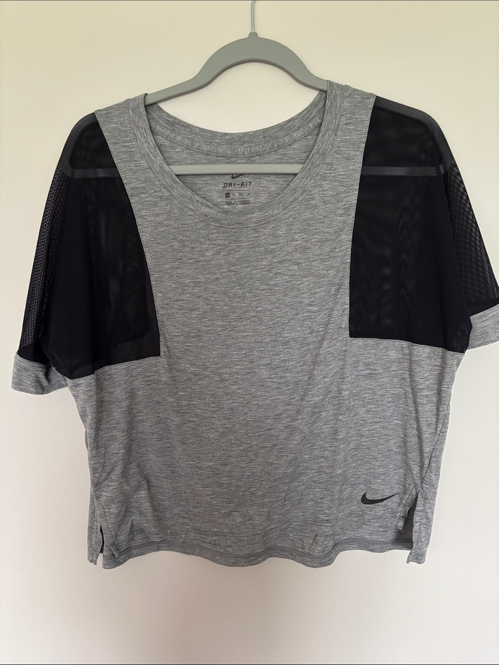 Woman’s Nike Gray Dri-FIT Heathered Performance Tee with Mesh Sleeves